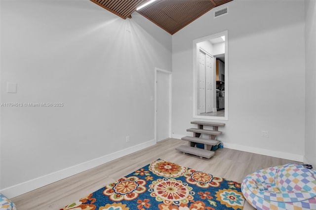 interior space featuring visible vents, baseboards, and wood finished floors