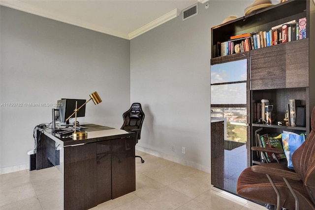 office with crown molding, baseboards, visible vents, and light tile patterned floors