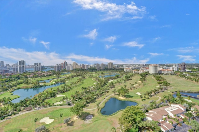 aerial view with a water view, view of golf course, and a city view