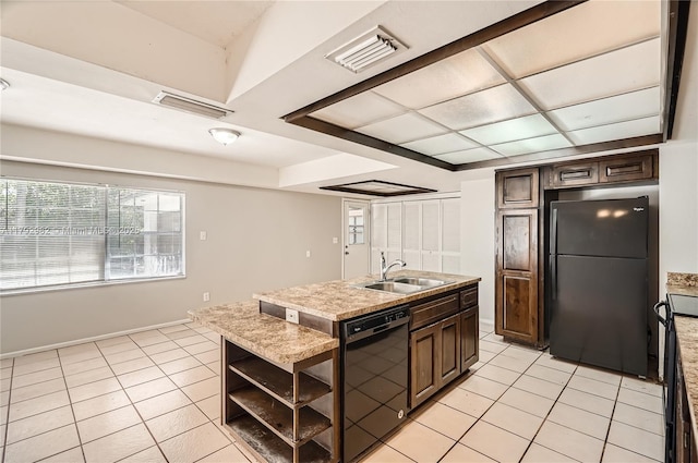 4109 NW 79th Ave, Coral Springs, FL 33065 - kitchen with open shelves, a center island with sink, light tile patterned floors, a sink, and black appliances