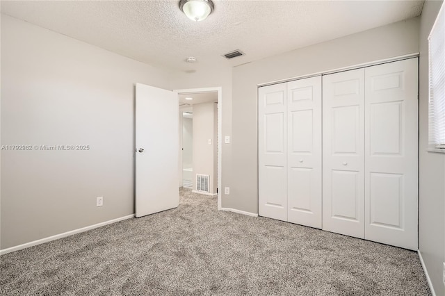 4109 NW 79th Ave, Coral Springs, FL 33065 - unfurnished bedroom with a textured ceiling, visible vents, baseboards, a closet, and carpet flooring