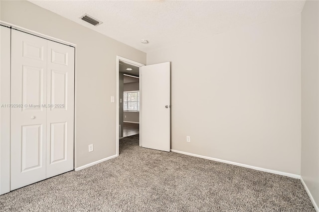 4109 NW 79th Ave, Coral Springs, FL 33065 - unfurnished bedroom with a textured ceiling, carpet, baseboards, visible vents, and a closet