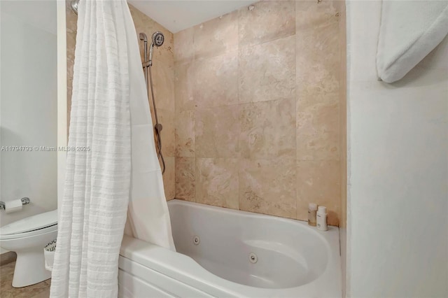 bathroom featuring a combined bath / shower with jetted tub and toilet