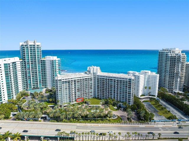 aerial view featuring a view of city and a water view