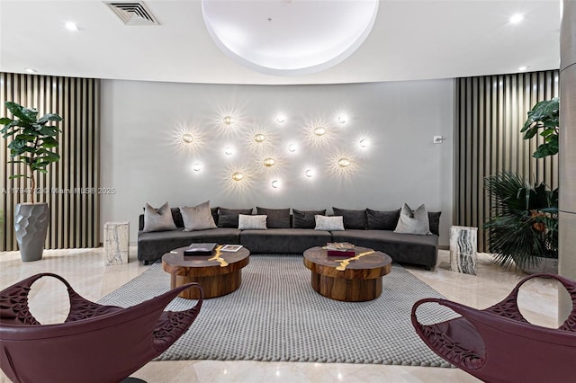 living room featuring visible vents and recessed lighting