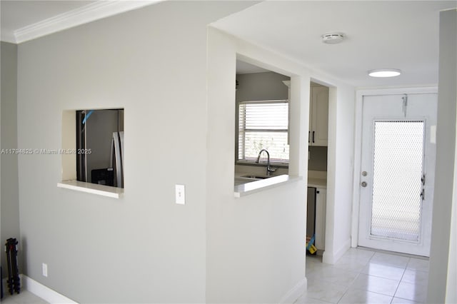 9900 Sunrise Lakes Blvd Unit 309, Sunrise, FL 33322 - hallway featuring a sink, crown molding, light tile patterned flooring, and baseboards