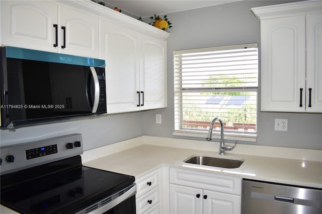 9900 Sunrise Lakes Blvd Unit 309, Sunrise, FL 33322 - kitchen featuring light countertops, a sink, white cabinets, and stainless steel appliances