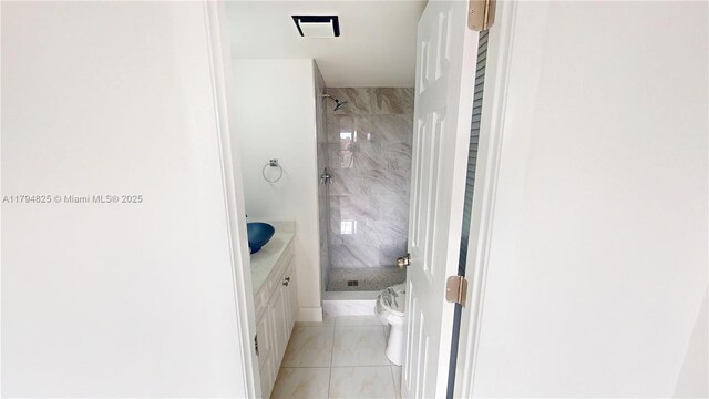 9900 Sunrise Lakes Blvd Unit 309, Sunrise, FL 33322 - bathroom featuring a shower stall, toilet, marble finish floors, and vanity