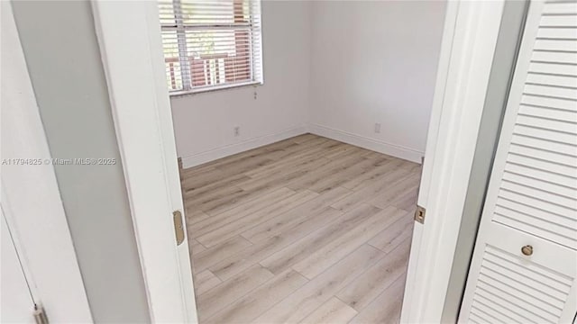 9900 Sunrise Lakes Blvd Unit 309, Sunrise, FL 33322 - unfurnished room with light wood finished floors and baseboards