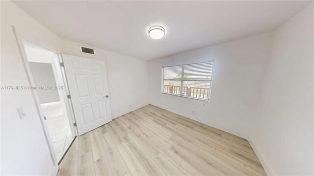 9900 Sunrise Lakes Blvd Unit 309, Sunrise, FL 33322 - unfurnished bedroom featuring light wood-type flooring and baseboards