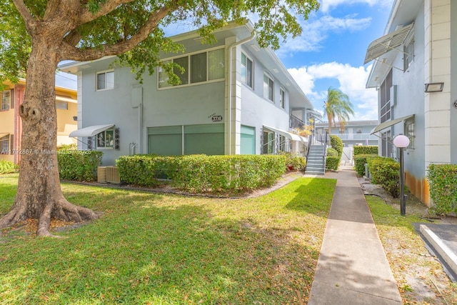 3710 Harrison St Unit 1, Hollywood, FL 33021 - view of building exterior featuring central air condition unit and stairs