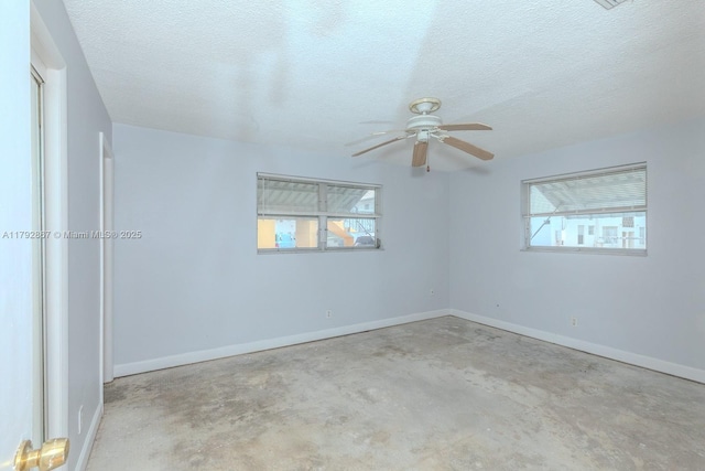 3710 Harrison St Unit 1, Hollywood, FL 33021 - empty room featuring a textured ceiling, ceiling fan, baseboards, and unfinished concrete floors