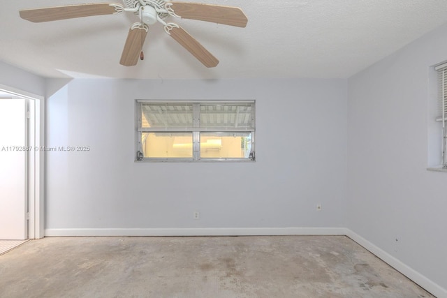 3710 Harrison St Unit 1, Hollywood, FL 33021 - empty room featuring concrete flooring, baseboards, and a ceiling fan