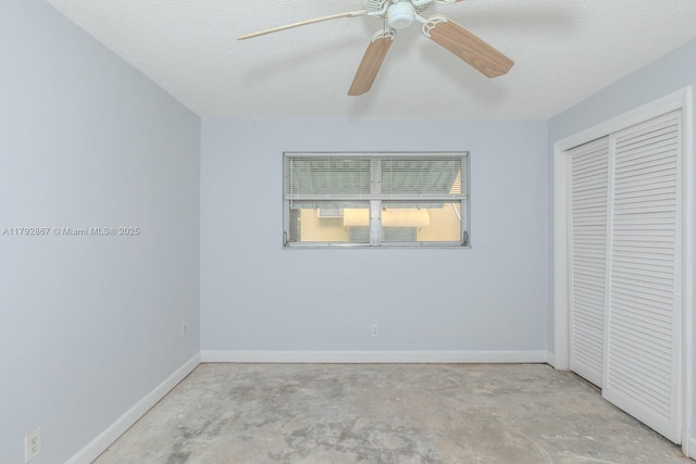 3710 Harrison St Unit 1, Hollywood, FL 33021 - unfurnished bedroom featuring concrete flooring, a textured ceiling, a ceiling fan, baseboards, and a closet