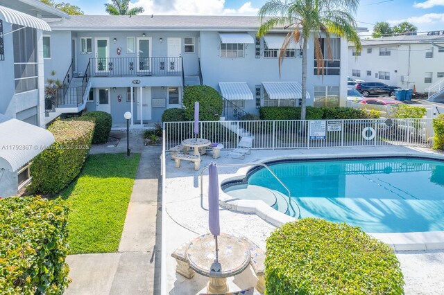 3710 Harrison St Unit 1, Hollywood, FL 33021 - community pool featuring a patio and fence