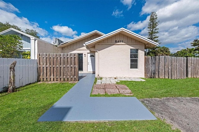5411 SW 43rd Ter, Dania Beach, FL 33314 - bungalow-style home featuring fence and a front yard