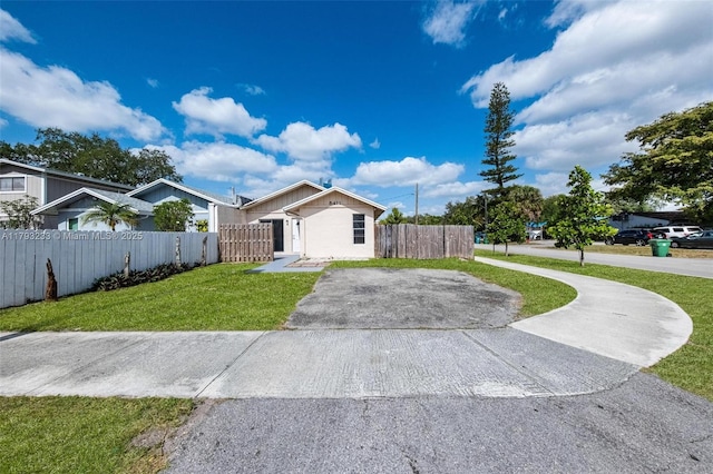 5411 SW 43rd Ter, Dania Beach, FL 33314 - single story home with a front lawn, a fenced front yard, and driveway