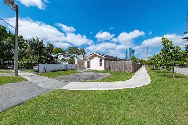 5411 SW 43rd Ter, Dania Beach, FL 33314 - view of front of house featuring fence and a front yard