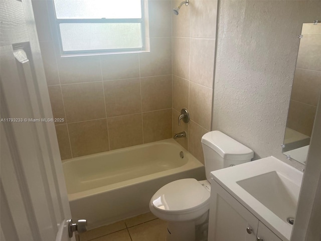 full bathroom with vanity, a textured wall, toilet, bathing tub / shower combination, and tile patterned floors