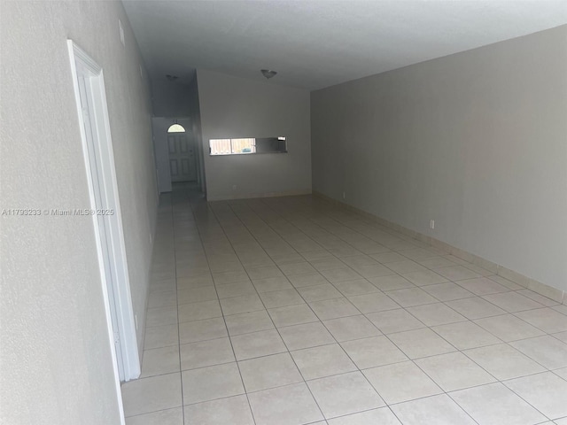 unfurnished room with light tile patterned floors