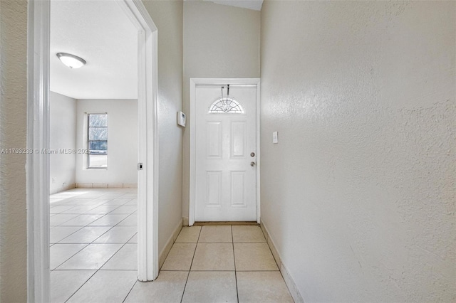 5411 SW 43rd Ter, Dania Beach, FL 33314 - interior space featuring baseboards, a textured wall, and light tile patterned flooring