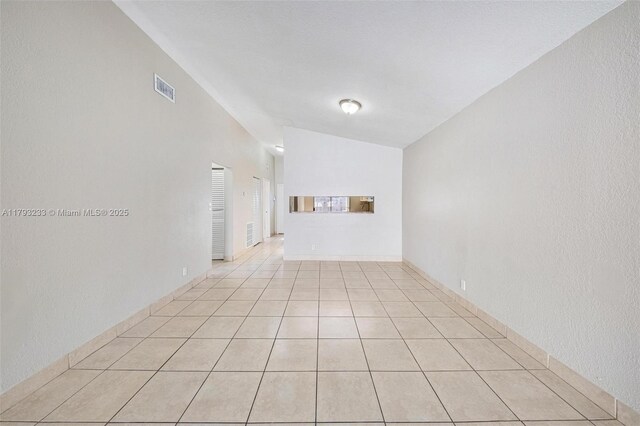 5411 SW 43rd Ter, Dania Beach, FL 33314 - spare room with lofted ceiling, light tile patterned flooring, and visible vents