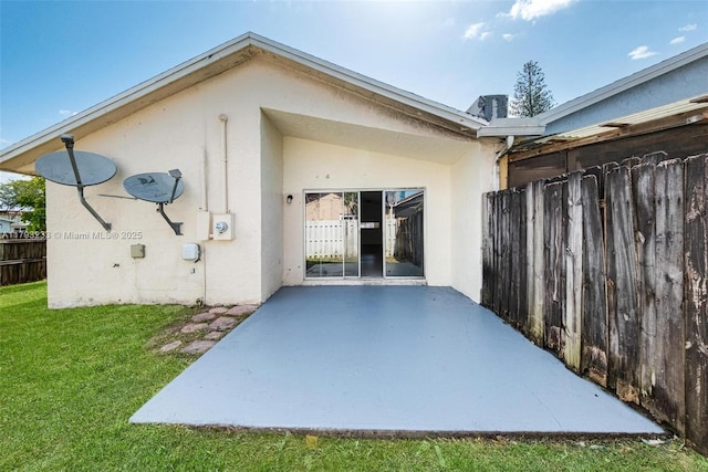5411 SW 43rd Ter, Dania Beach, FL 33314 - back of property featuring fence, a patio, stucco siding, and a yard