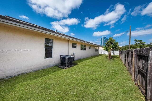 5411 SW 43rd Ter, Dania Beach, FL 33314 - view of yard featuring a fenced backyard and central AC unit