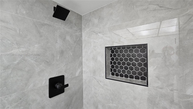 details with a tile shower