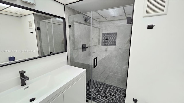 full bath with vanity and a stall shower