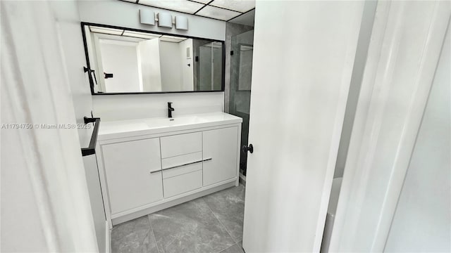 bathroom with marble finish floor and vanity