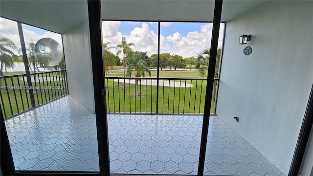 unfurnished sunroom featuring a healthy amount of sunlight and a water view
