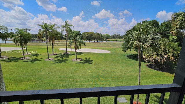 surrounding community with a lawn and view of golf course