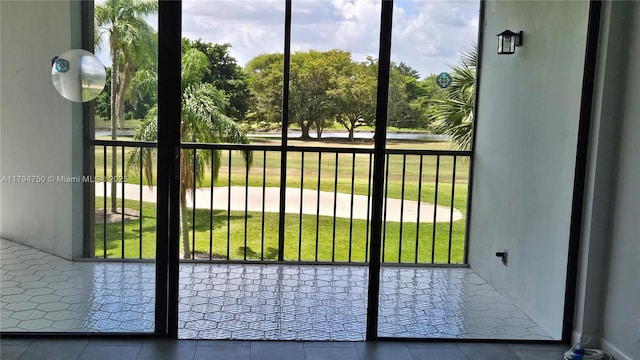 doorway to outside with tile patterned floors