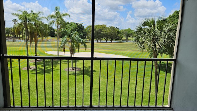view of property's community featuring a water view and a yard