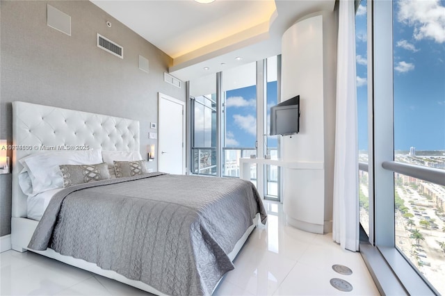 17121 Collins Ave Unit 2608, Sunny Isles Beach, FL 33160 - bedroom featuring light tile patterned floors, multiple windows, floor to ceiling windows, and visible vents