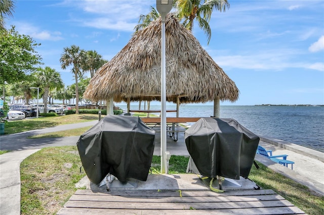 view of dock featuring a water view and a gazebo