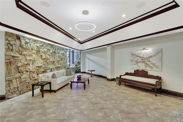 living room with crown molding, baseboards, and lofted ceiling
