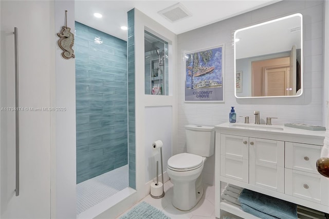 full bath featuring visible vents, tile patterned floors, vanity, toilet, and tiled shower