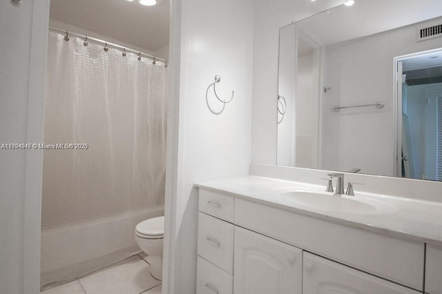full bath featuring visible vents, tile patterned flooring, shower / tub combo, vanity, and toilet