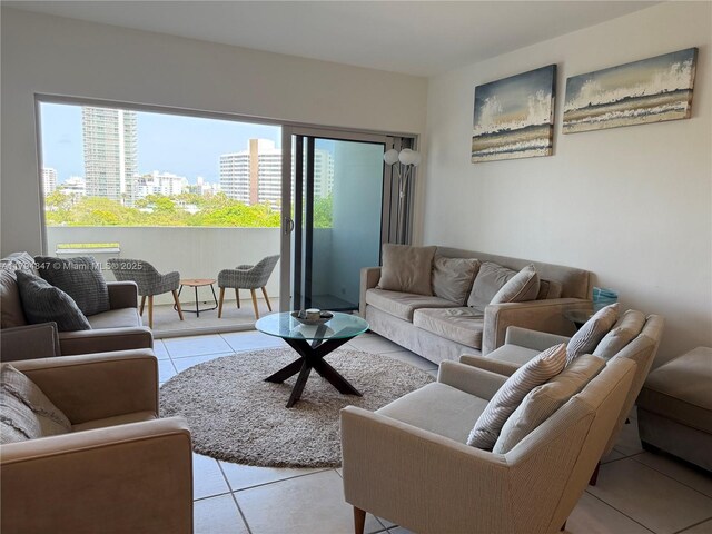 3 Island Ave Unit 07B, Miami Beach, FL 33139 - living area featuring light tile patterned floors, healthy amount of natural light, and a view of city