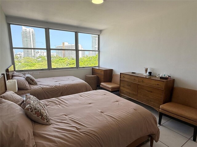 3 Island Ave Unit 07B, Miami Beach, FL 33139 - bedroom with a view of city and tile patterned flooring