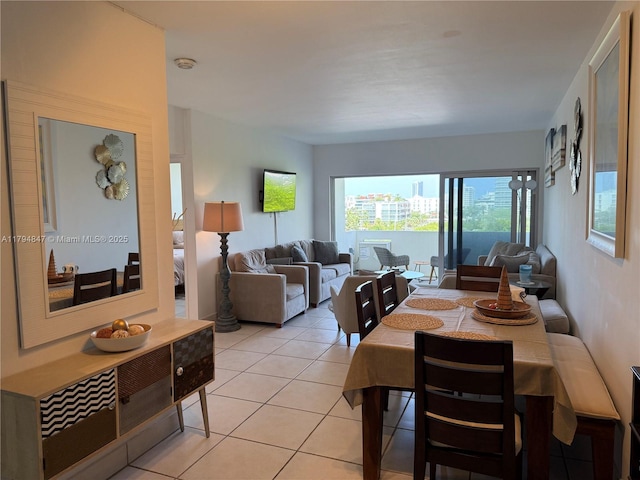 3 Island Ave Unit 07B, Miami Beach, FL 33139 - dining area featuring light tile patterned flooring