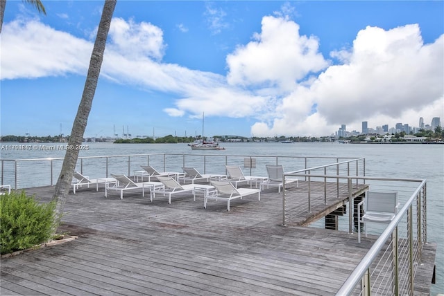 dock area featuring a deck with water view