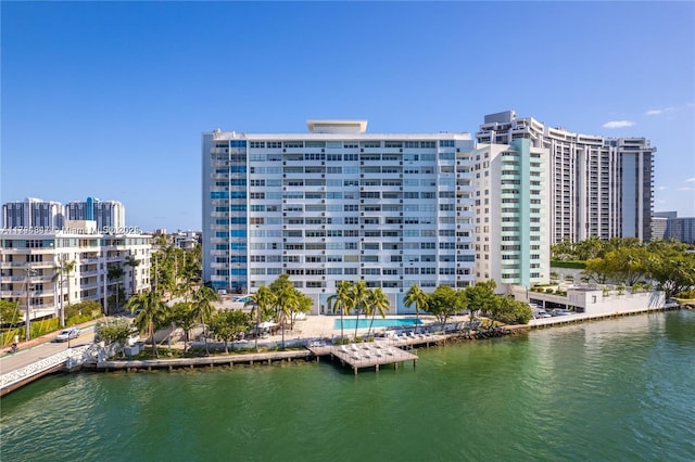 exterior space featuring a view of city and a water view