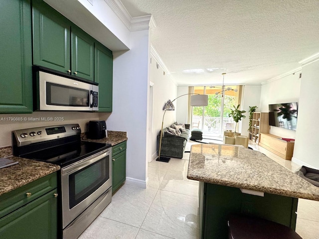 3001 NE 185th St Unit 225, Aventura, FL 33180 - kitchen with appliances with stainless steel finishes, green cabinetry, ornamental molding, and open floor plan