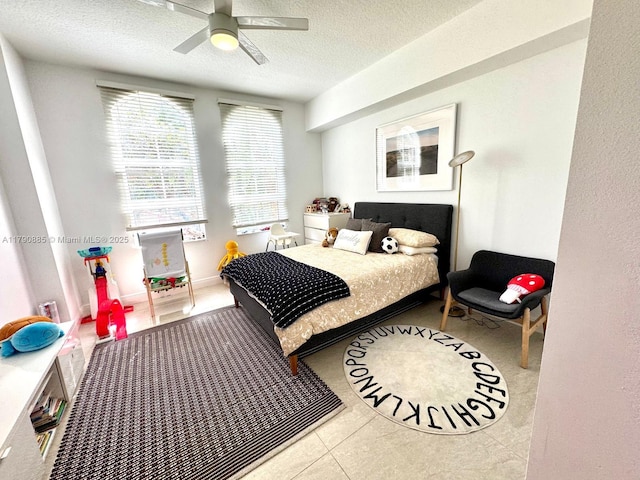 3001 NE 185th St Unit 225, Aventura, FL 33180 - bedroom featuring a textured ceiling, ceiling fan, and tile patterned floors