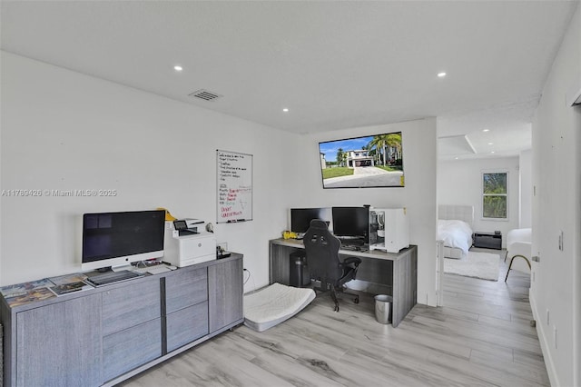 office featuring visible vents, recessed lighting, and light wood-style floors