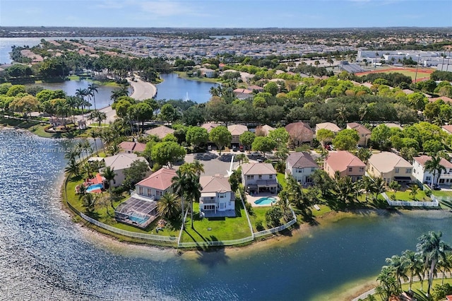 bird's eye view with a water view and a residential view