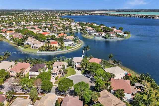 bird's eye view featuring a residential view and a water view